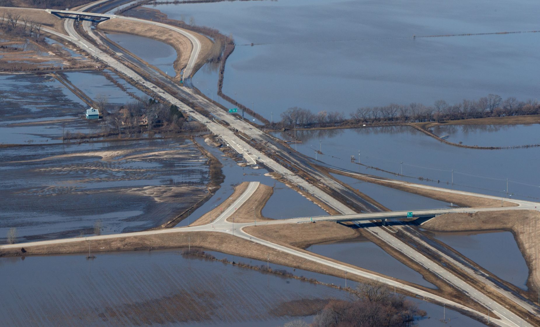 Floodwaters from the Elkhorn River have gone down and now expose a heavily damaged West Dodge Road.